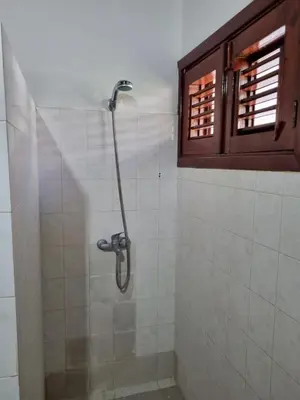 a shower stall in a bathroom with a window at Sunset Paradise in Las Terrenas