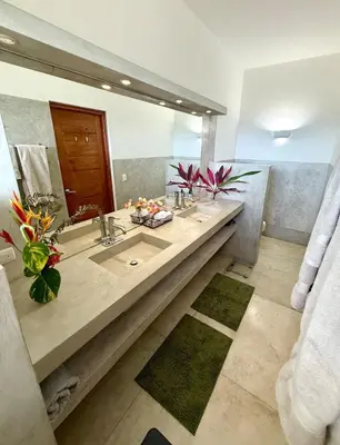 a bathroom with two sinks and a large mirror at Casa Amalfi Luxury Oceanview Villa with Pool in Cabrera