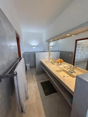 a bathroom with a sink and a large mirror at Casa Amalfi Luxury Oceanview Villa with Pool in Cabrera