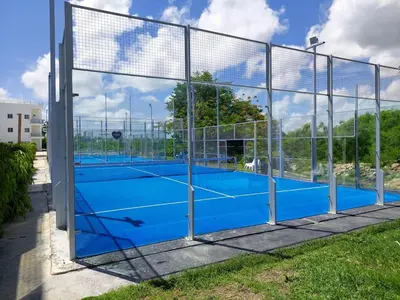 a tennis court with a net at Apartamento Luxury Punta Cana in Punta Cana
