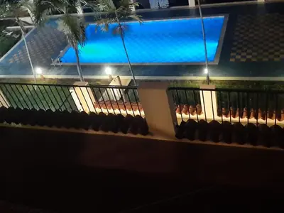 a balcony with a swimming pool on a boat at Palm Beach Resort in Boca Chica
