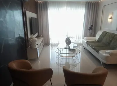 a living room with a couch and a table at Torre Sky 01 M10-2 in Santo Domingo