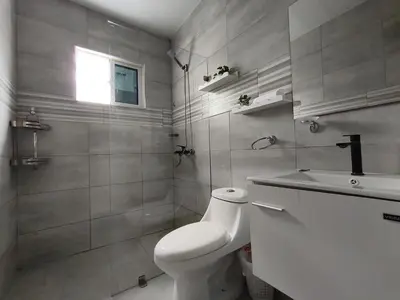 a white bathroom with a toilet and a sink at América Colares VII in Los Frailes