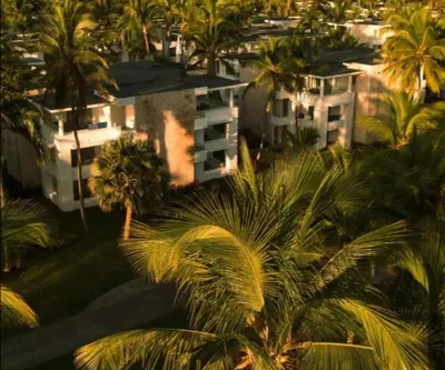 an aerial view of a city with palm trees and buildings at Caribe Deluxe Princess - All Inclusive in Punta Cana