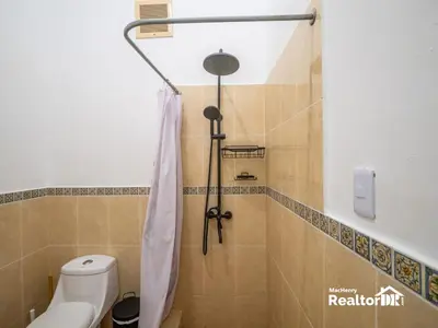 a bathroom with a shower and a toilet at Casa Estrella, Where Relaxation Begins in Sosúa