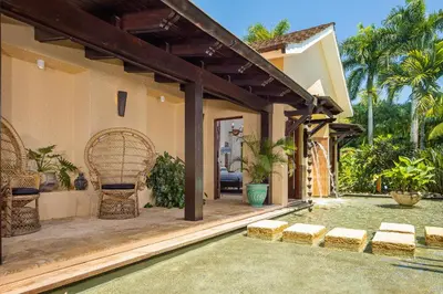 an external view of a house with a swimming pool at Villa Maji Luxury Private Villa Steps from the Ocean Sea Horse Ranch Cabarete in Cabarete