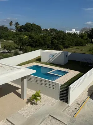 a swimming pool on the roof of a house at spectrum stay in Baní