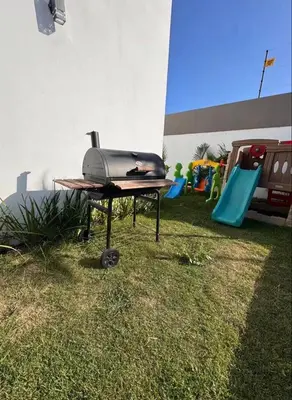 a grill sitting on a table in the grass at Luxury Caribbean Oasis in La Romana