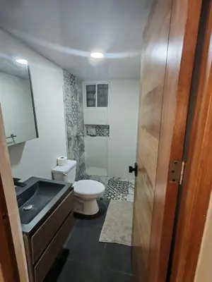 a bathroom with a sink and a toilet at Condominio Esperanza B102 in San Pedro de Macorís