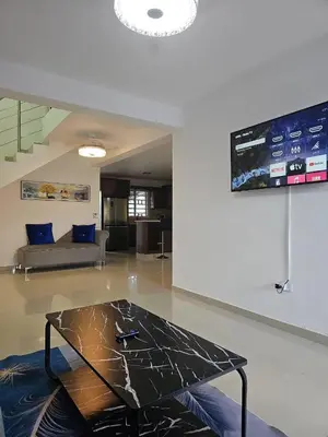 a glass coffee table in a living room with a couch at Naime 3 Bristol villa in San Pedro de Macorís