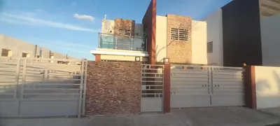a white fence in front of a building at Naime 3 Bristol villa in San Pedro de Macorís