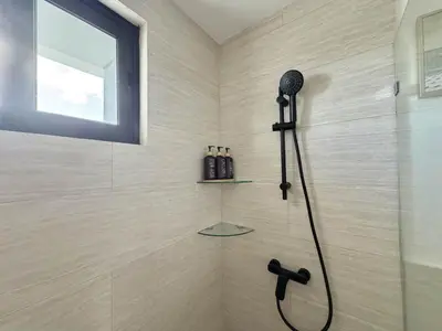 a shower with a shower head in a bathroom at Modern 1B 5 min to CapCana Beach in Las Terrenas