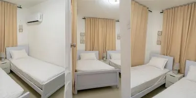 a room with two beds and a mirror at Beautiful apartment on the 2nd floor in Boca Residence