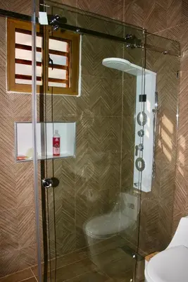a shower with a glass door in a bathroom at Villa lobos in Concepción de La Vega