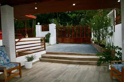 a patio with stairs and a wooden fence at Villa lobos in Concepción de La Vega