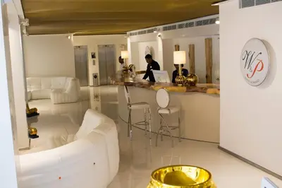 a living room with a white couch and a table at W&P Santo Domingo in Santo Domingo