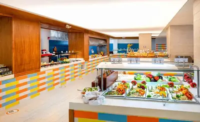 a cafeteria filled with lots of food on display at Viva Tangerine by Wyndham, A Trademark All Inclusive in Cabarete
