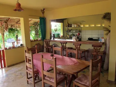a kitchen and dining room with a table and chairs at Corales Punta Rusia in Punta Rucia
