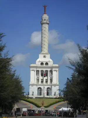 a white tower with a cross on top of it at Centro de Santiago in Santiago de los Caballeros