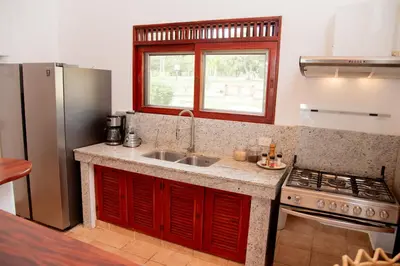 a kitchen with a sink and a stove at Villa Diana in Las Galeras