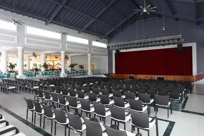 an empty hall with a stage and chairs at Bahia Principe Fantasia Punta Cana - All Inclusive in Punta Cana