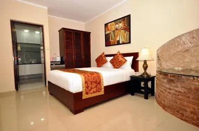 a bedroom with a large bed in a room at Boutique Hotel Palacio in Santo Domingo