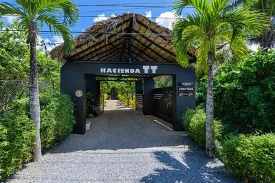 a blue building with a sign that reads macarthur h at Adults-Only Hacienda Terra Taina in Las Terrenas