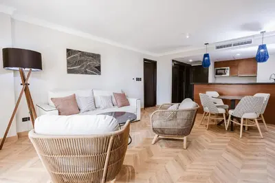 a living room with a couch and chairs and a table at Dominican Fiesta Hotel in Santo Domingo