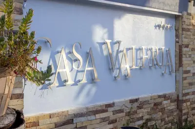 a sign that says akaria on the side of a building at Casa Valeria Boutique Hotel in Sosúa
