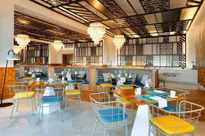 a restaurant with tables and chairs in a room at TRS Turquesa Hotel - Adults Only - All Inclusive in Punta Cana