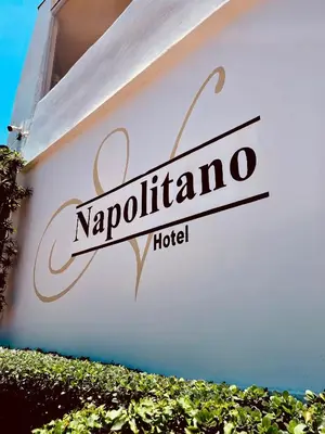 a sign for a napolitano hotel on a building at Napolitano Hotel in Santo Domingo