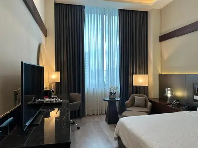 a hotel room with a bed and a television at Holiday Inn Santo Domingo by IHG in Santo Domingo