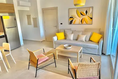 a living room with a couch and a table at Estrella Dominicus Advantage in Bayahibe