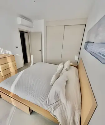 a bedroom with a large bed with white sheets at Estrella Dominicus Advantage in Bayahibe