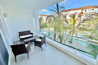 a balcony with a piano and a table and chairs at Estrella Dominicus Advantage in Bayahibe