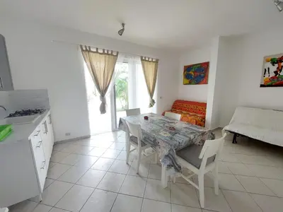 a kitchen and dining room with a table and chairs at Tamarindo in Bayahibe