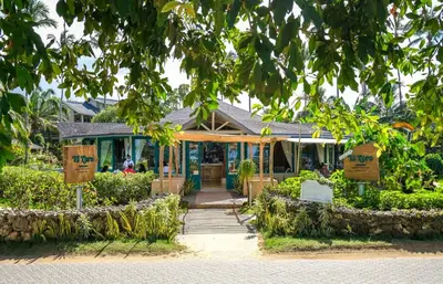 a house with signs in front of it at Hotel Alisei in Las Terrenas