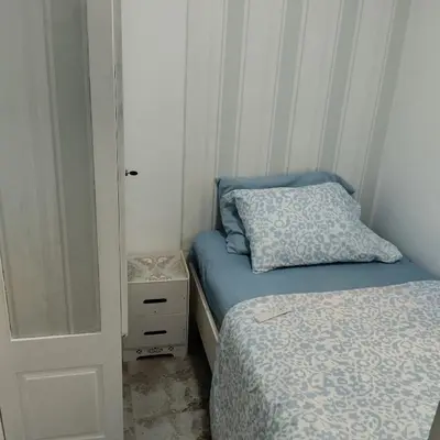 a small bedroom with two beds and a closet at Nely y Pietro share apartment in Punta Cana