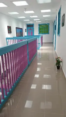 a hallway of a hospital with pink and blue at Hostal Johnnier Macao Punta Cana in Punta Cana
