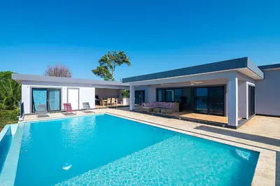 a swimming pool in front of a house at House 24 in Casa Linda in Sosúa