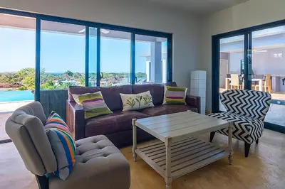 a living room with a couch and a table at House 24 in Casa Linda in Sosúa