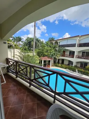 a view from the balcony of a hotel with a swimming pool at Apartamento en Las Terrenas in Las Terrenas