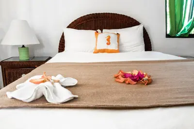 a bed with towels and dolls on it at Riviera Punta Cana Eco Travelers in Punta Cana