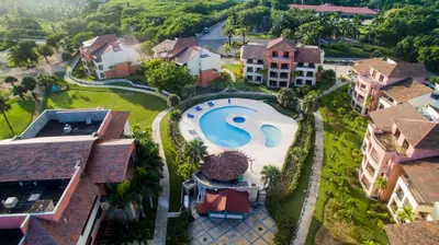 an aerial view of a house with a swimming pool at Tot Punta Cana Apartments in Punta Cana