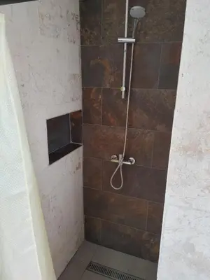 a shower with a glass door in a bathroom at Villa Roberta in Boca Chica