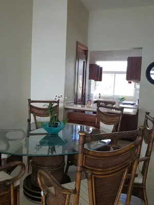 a dining room with a glass table and chairs at Hidden Paradise at Apto Del Cerro in Santa Bárbara de Samaná