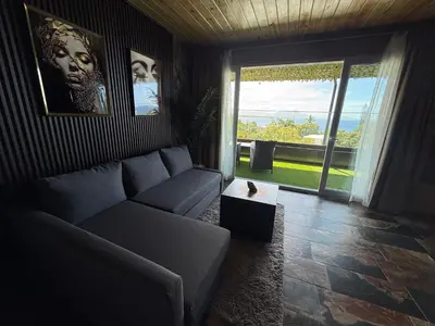 a living room with a couch and a table at Sosua Inn Hotel in Sosúa