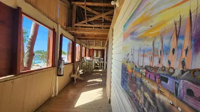 a hallway with a painting on the side of a building at Tropic ecolodge in Punta Rucia