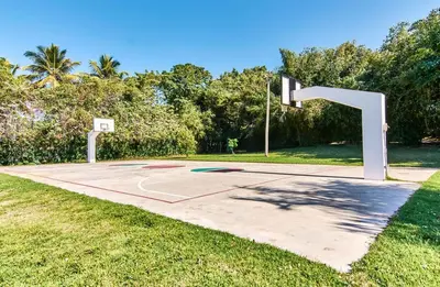a basketball court with a hoop in a park at Hispaniola Residencial private villas in Sosúa