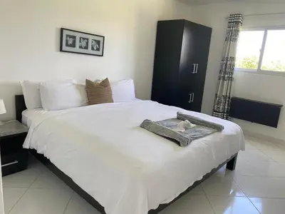 a bedroom with a large bed with a towel on it at El Cabarete Spa Resort all-Inclusive in Cabarete